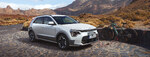 Bild Kia Niro in weiß vor Bergkulisse 